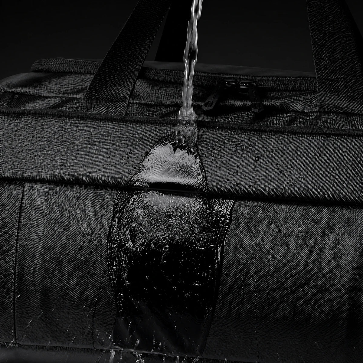 Sac de voyage ordinateur Le Voyage, jet d'eau sur le tissu déperlant